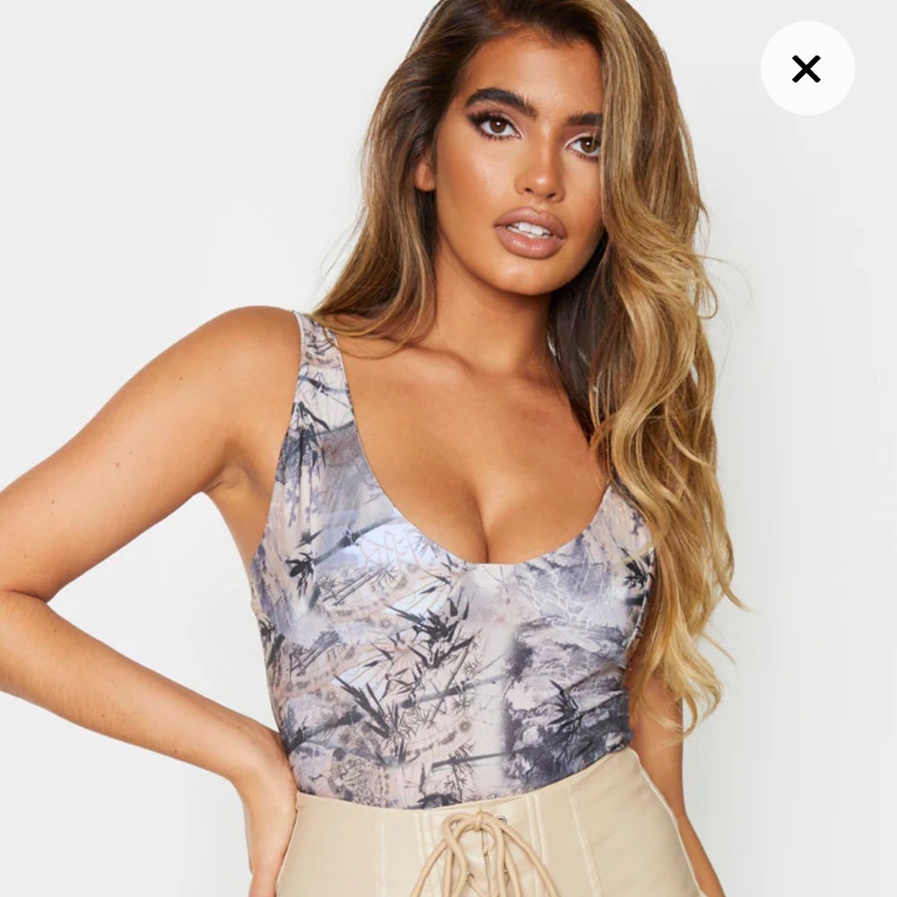 PLT nude printed bodysuit. Size 0. Never worn. Excellent condition.